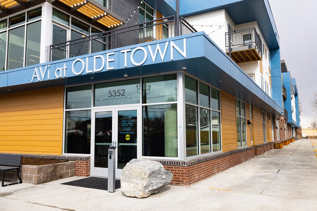 Olde Town Avi is a building with a blue and yellow exterior.