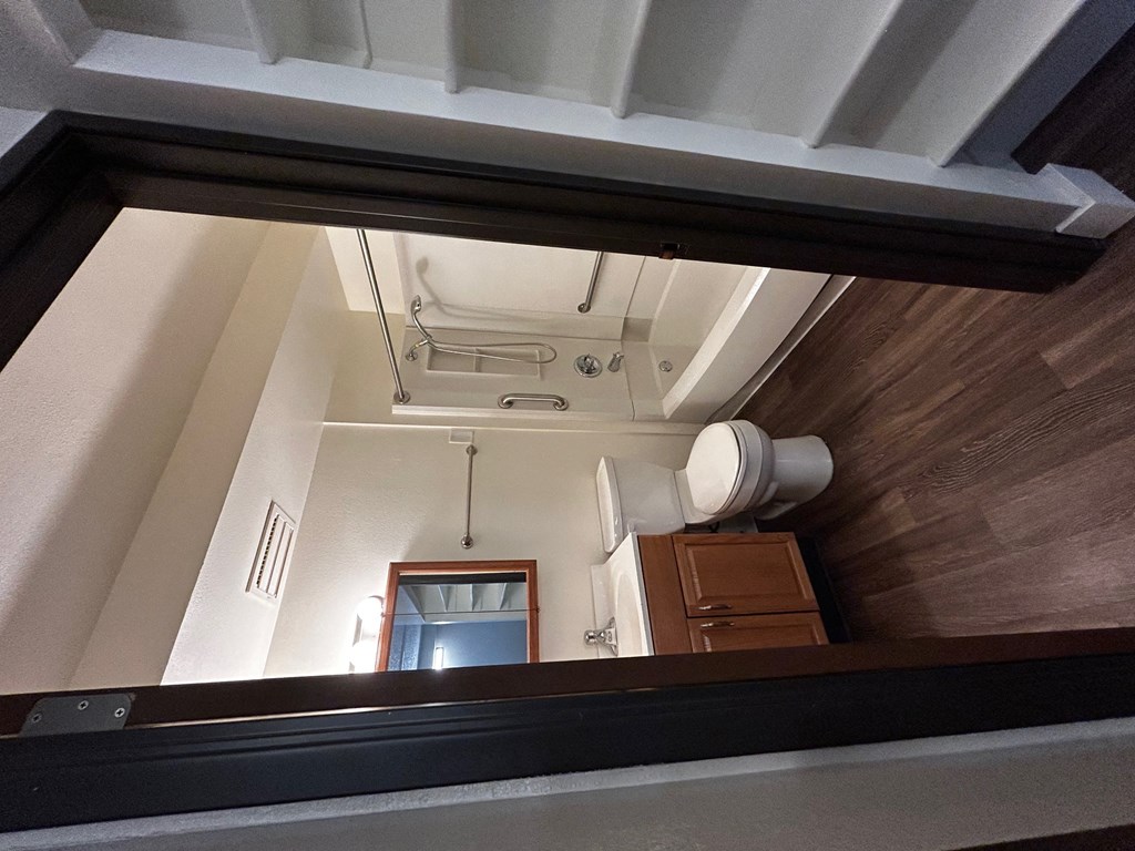 a reflection of a bathroom in a mirror