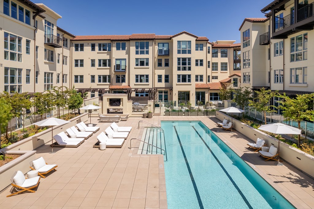 lap pool with lounge chairs
