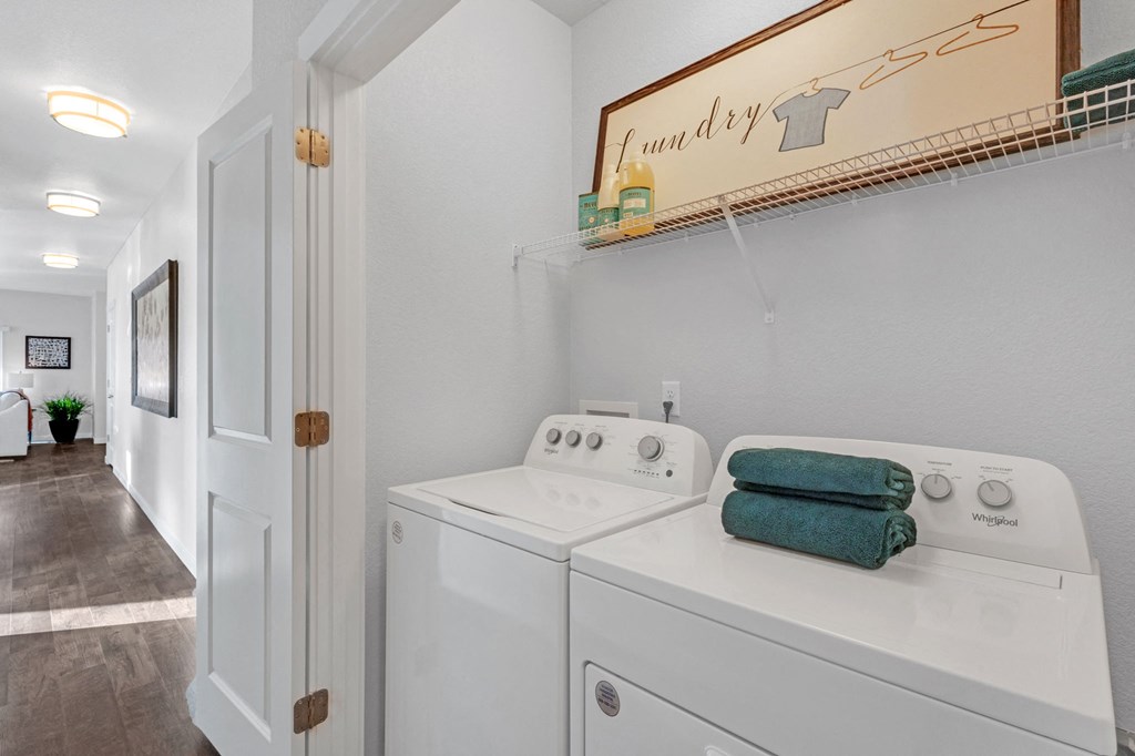 A laundry room with a washer and dryer.
