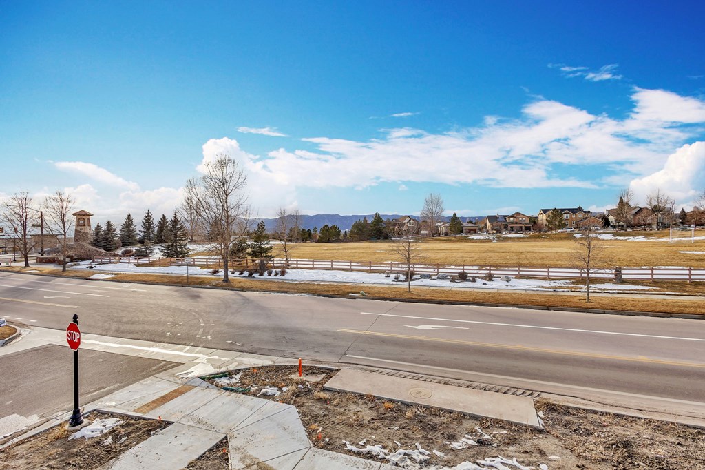 A stop sign is on a pole at a street corner.