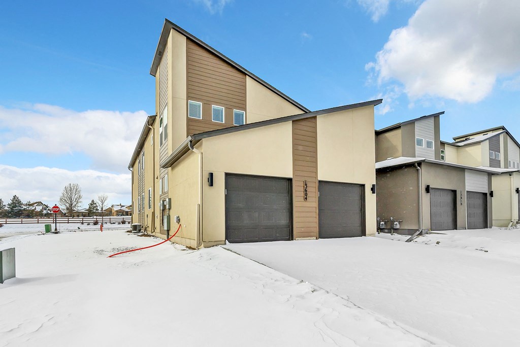 A large building with a red hose attached to it.
