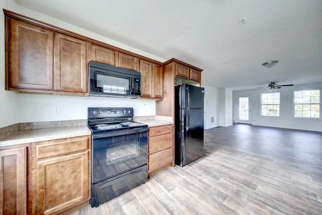 kitchen with wood cabinets and black appliances