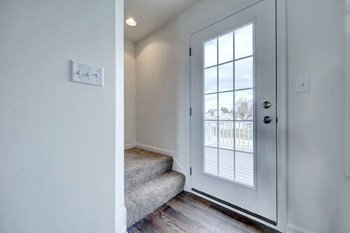 stairwell with grey carpet hardwood floors hallway leading to den - Photo Gallery 33