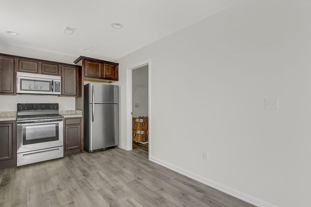 Kitchen with stainless steel appliances and wooden floors at Hudson Ridge, Red Lion, Pennsylvania