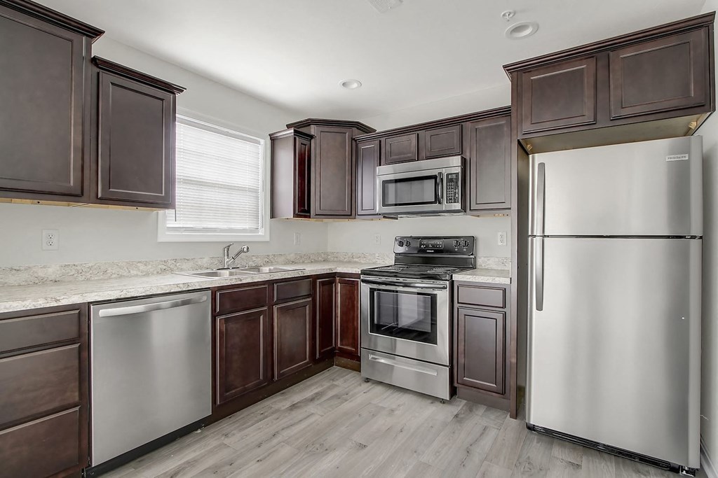 Kitchen with stainless steel appliances and wooden cabinets at Hudson Ridge, Red Lion, Pennsylvania