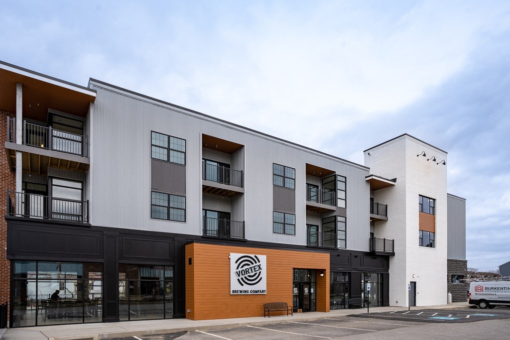 the exterior of a building with a logo on it at Franklin Square Apartments/Townhomes, New Freedom, PA