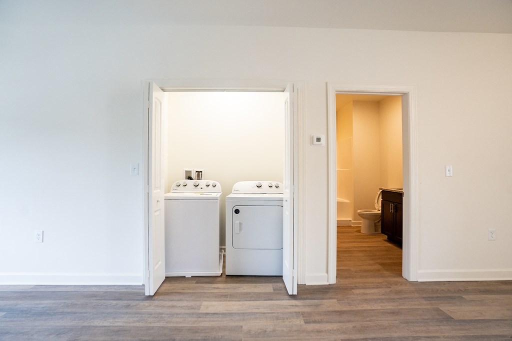 a room with a washer and dryer and a door to a laundry room at Franklin Square Apartments/Townhomes, New Freedom, 17349