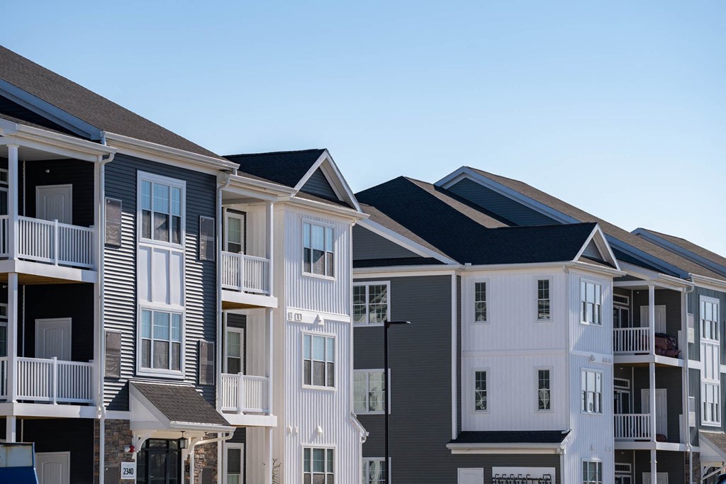 Row of townhomes with black roofs at Holly Oaks, Aberdeen, Maryland.