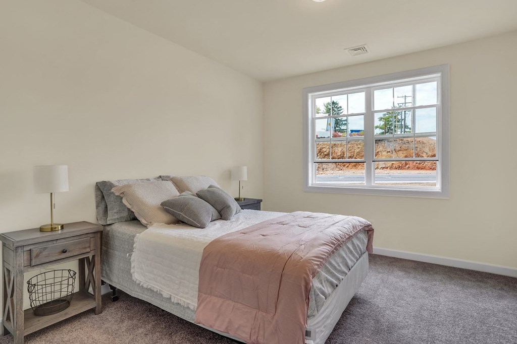 Bedroom with grey carpet natural light  at Rowen Place Apartments, Pennsylvania