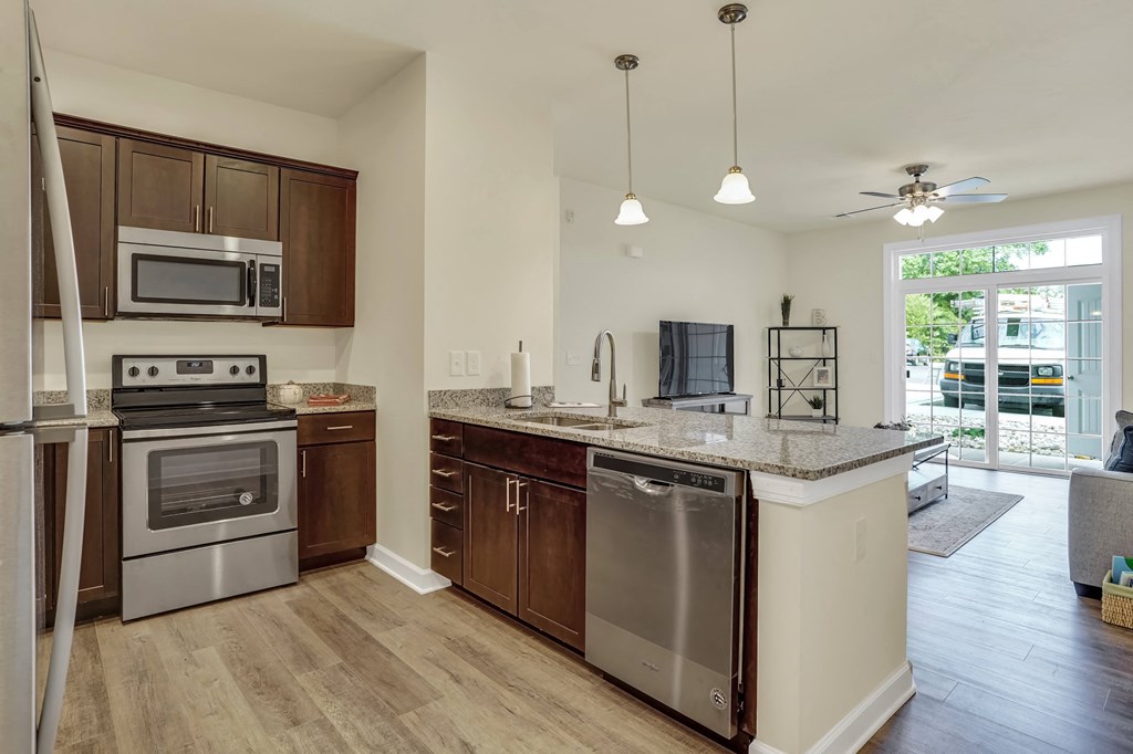 kitchen with dark cabinets and granite countertops  at Rowen Place Apartments, Pennsylvania