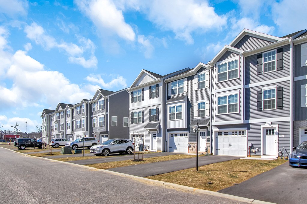 exterior grey and sage siding white trim white garage  at Franklin Square Apartments/Townhomes, Pennsylvania, 17349