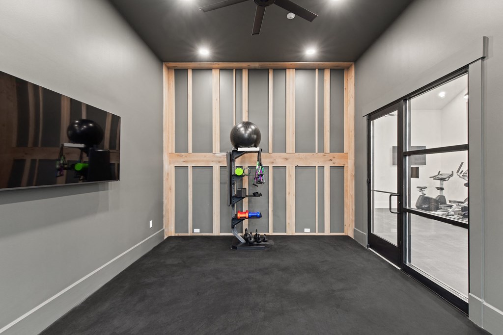 Gym equipment and a large window and a ceiling fan at Hadley Place Apartments, Pennsylvania, 17025
