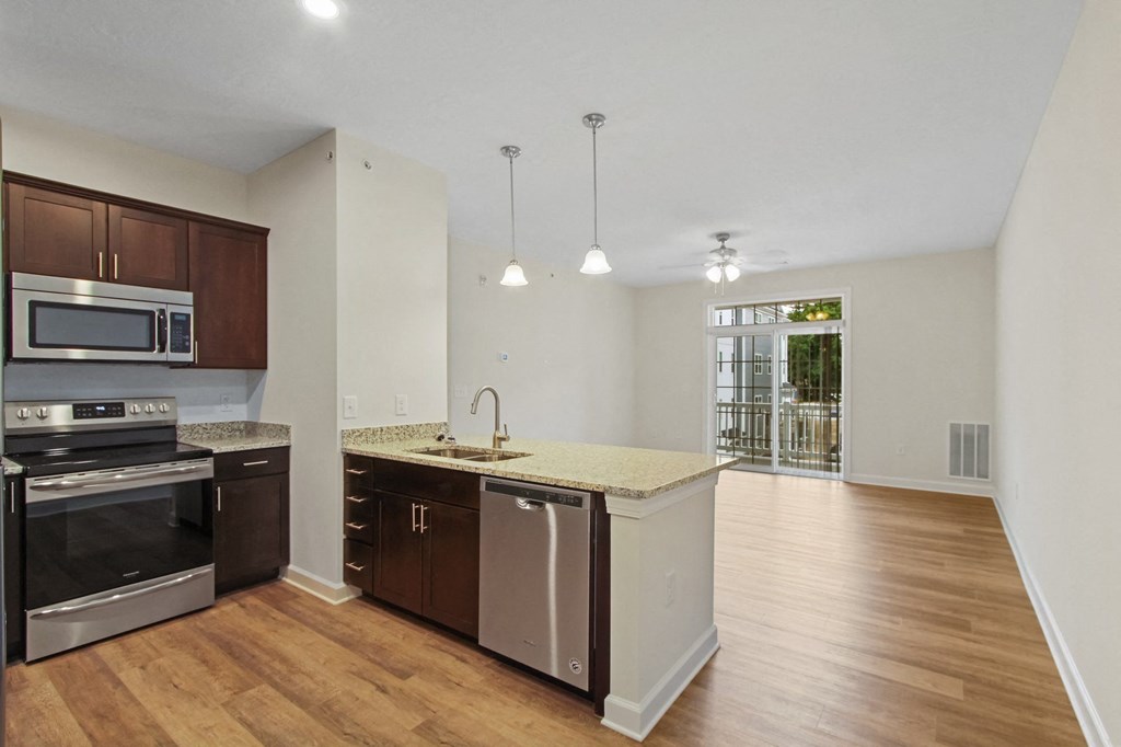 Kitchen sink and stove at Hadley Place Apartments, Enola