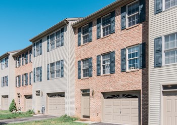 brick and beige siding beige garage doors - Photo Gallery 2