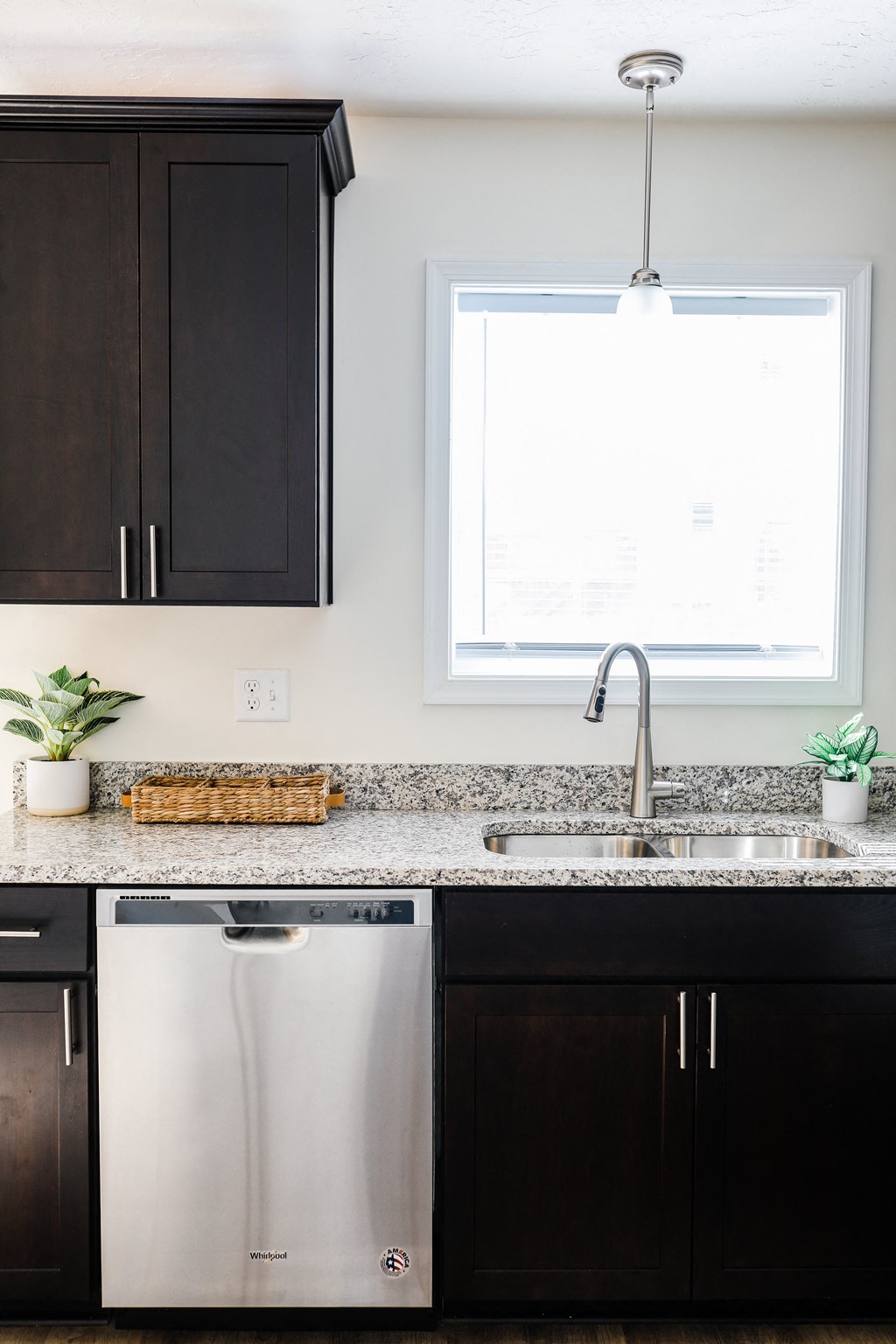 Kitchen with dark cabinets and granite countertops at Hudson Ridge, Red Lion, PA, 17356