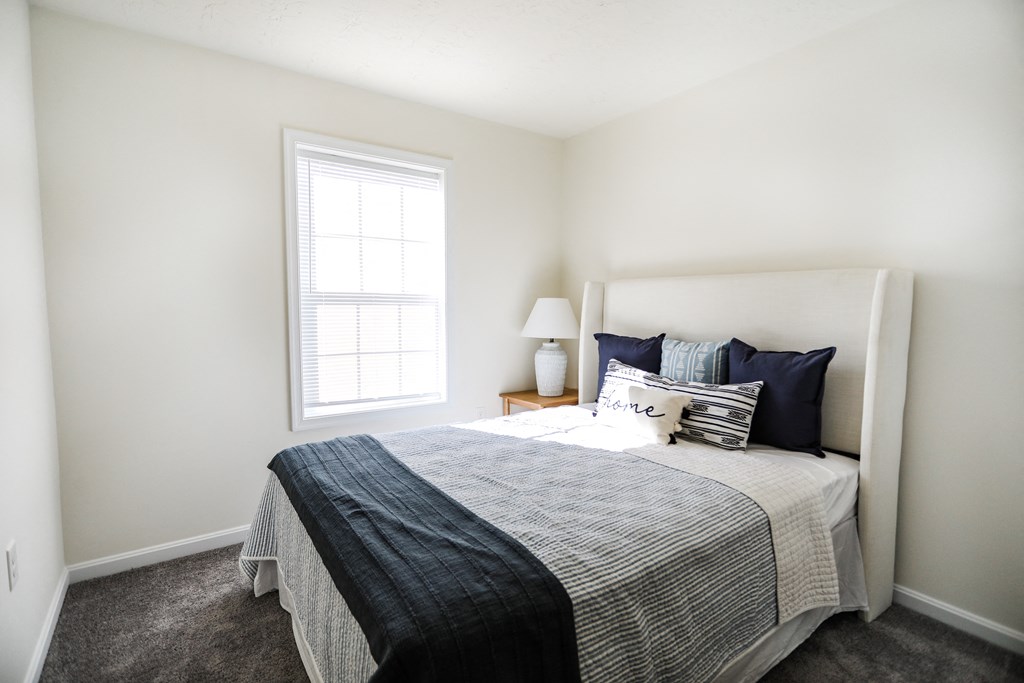Bedroom with a bed and a nightstand with a lamp at Hudson Ridge, Pennsylvania, 17356