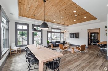 Wynfield Clubhouse with a wooden ceiling and a large table and chairs