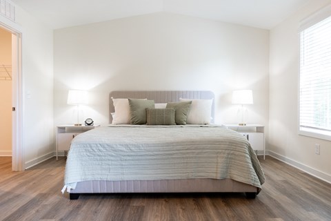 master bedroom with a king bed and two nightstands at Beckington, Leland, NC