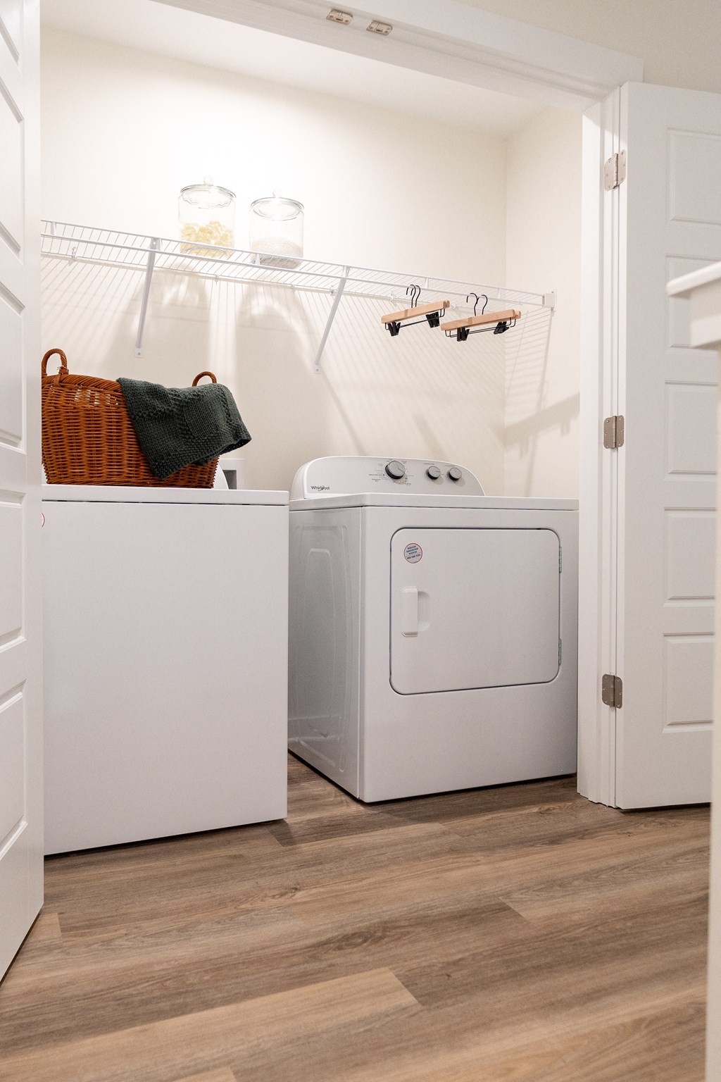 White washer and dryer in a laundry room 