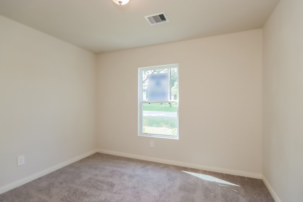 an empty room with a window in it