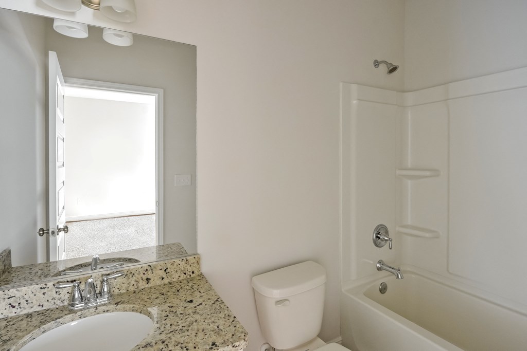 a bathroom with a sink toilet and a tub