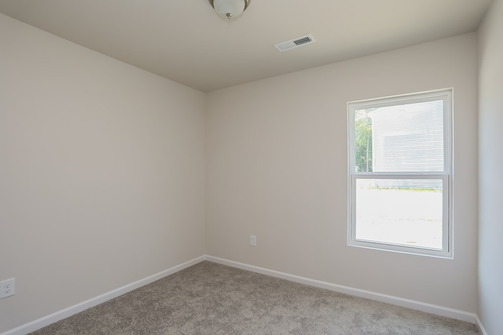 an empty room with a window in it