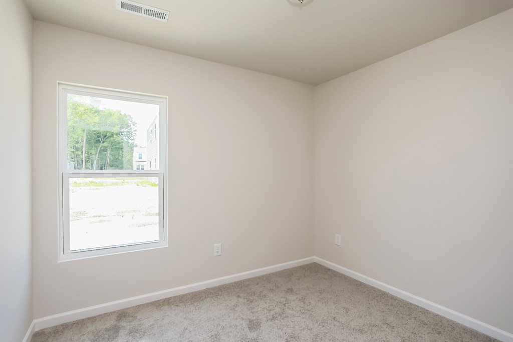 an empty room with a window in it