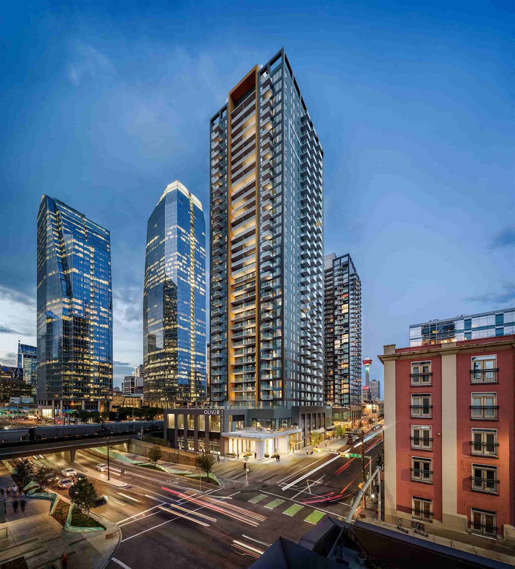 a view of skyscrapers in the city at night