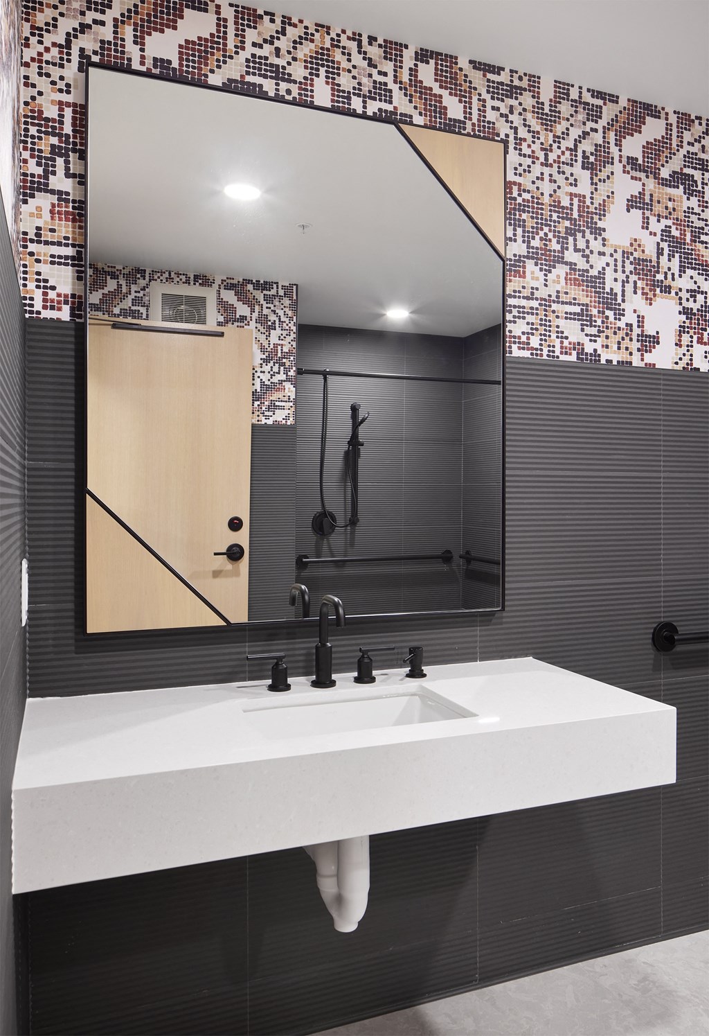 a bathroom with a sink and a large mirror