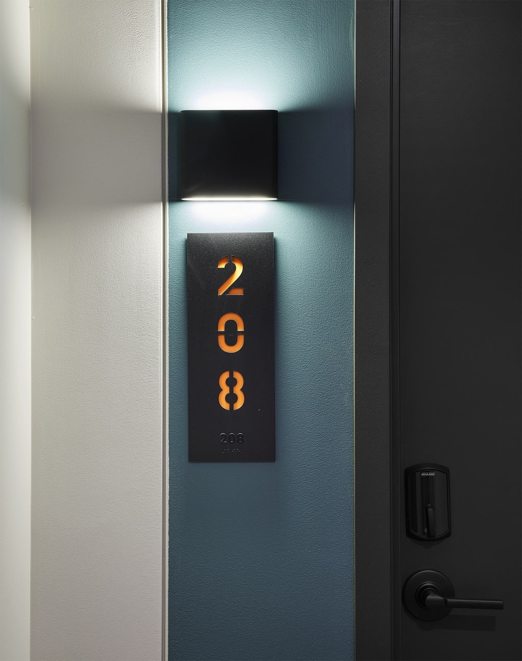 an elevator with a clock on the side of it