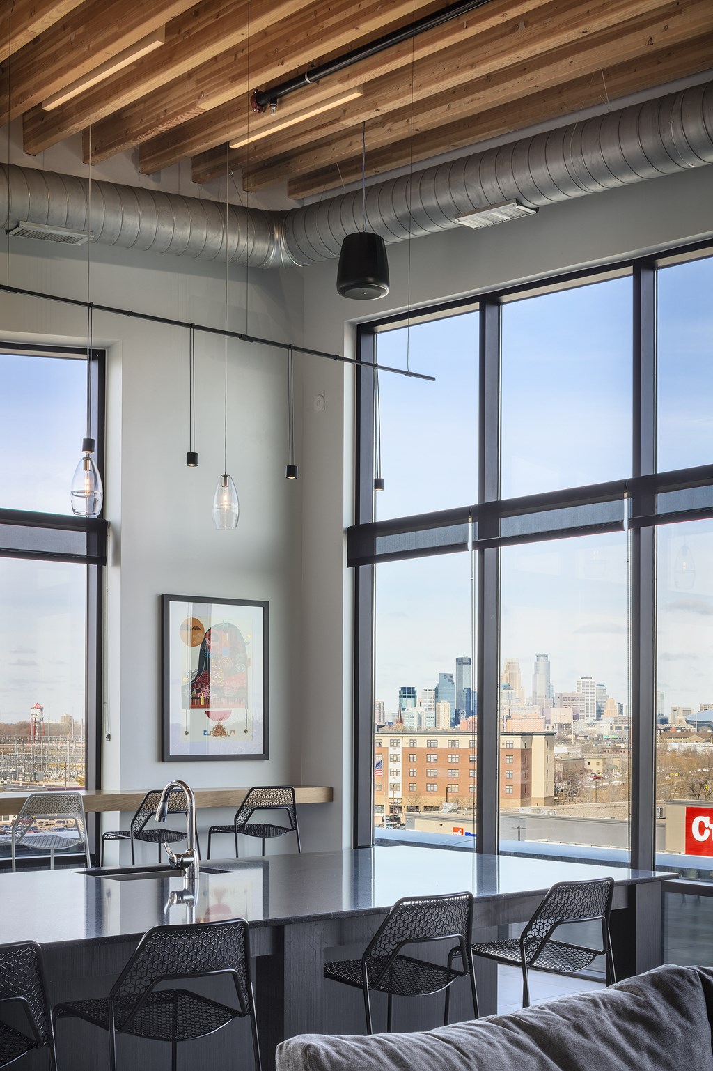 the view of the city from the living room of a modern apartment