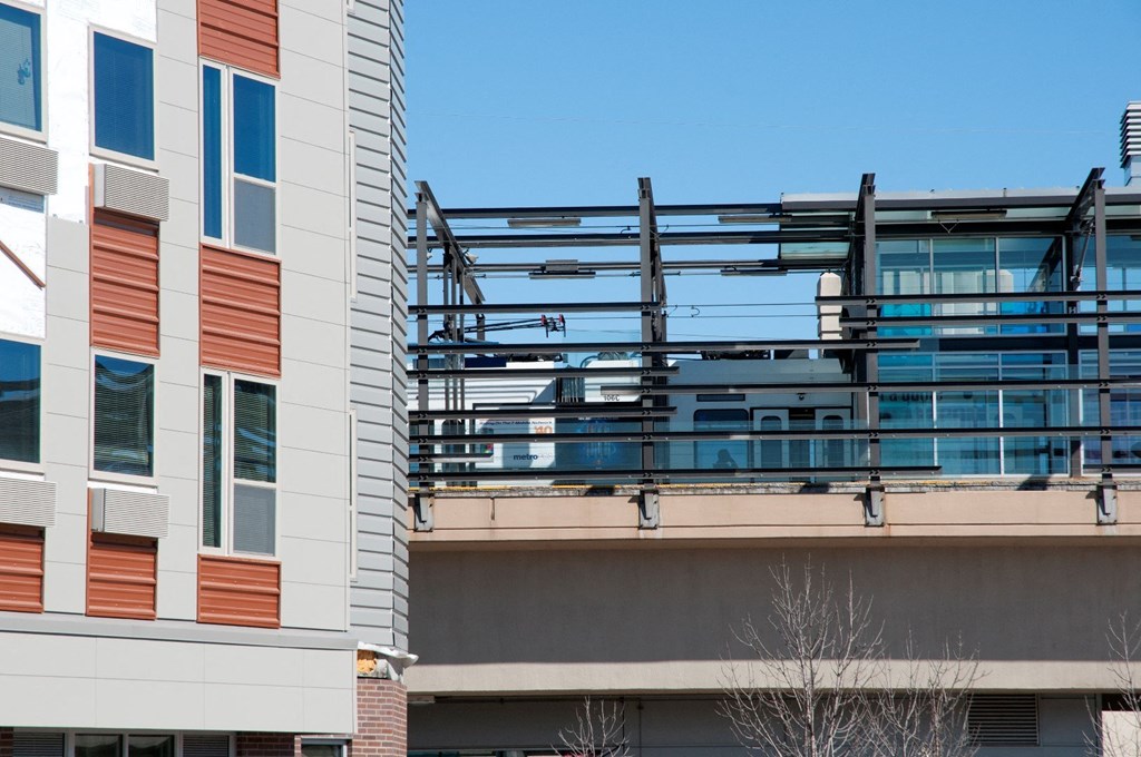 a balcony on the side of a building with a blue sky