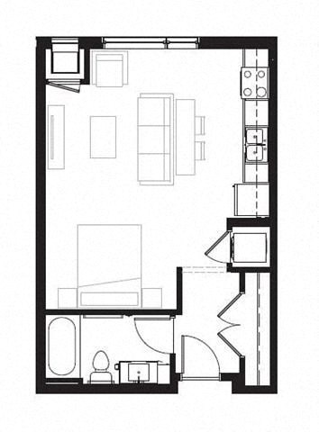 a small room with a desk and a chair