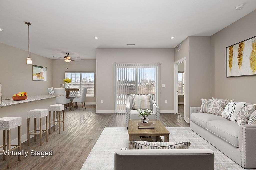 a living room and dining room with a couch and a table