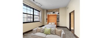 A bedroom with a large bed and a window with blinds.