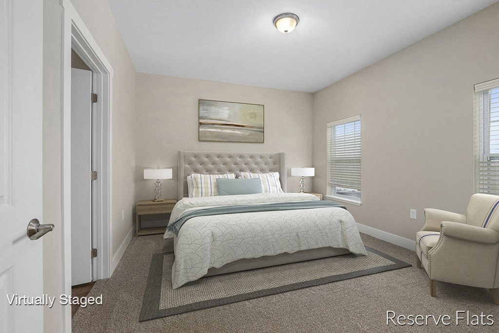 a bedroom with a bed and a pattern on the wall