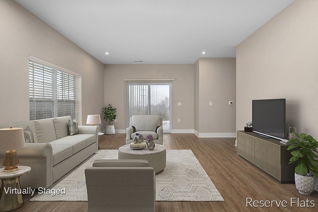 a living room with a couch and a tv