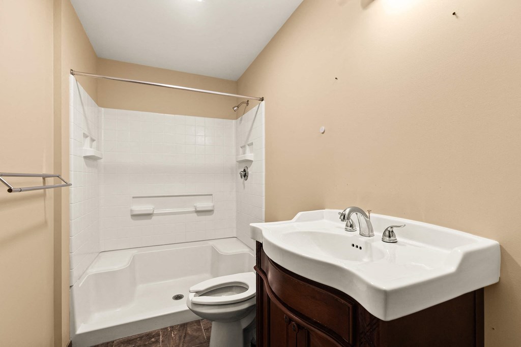 a bathroom with a sink and a toilet and a tub
