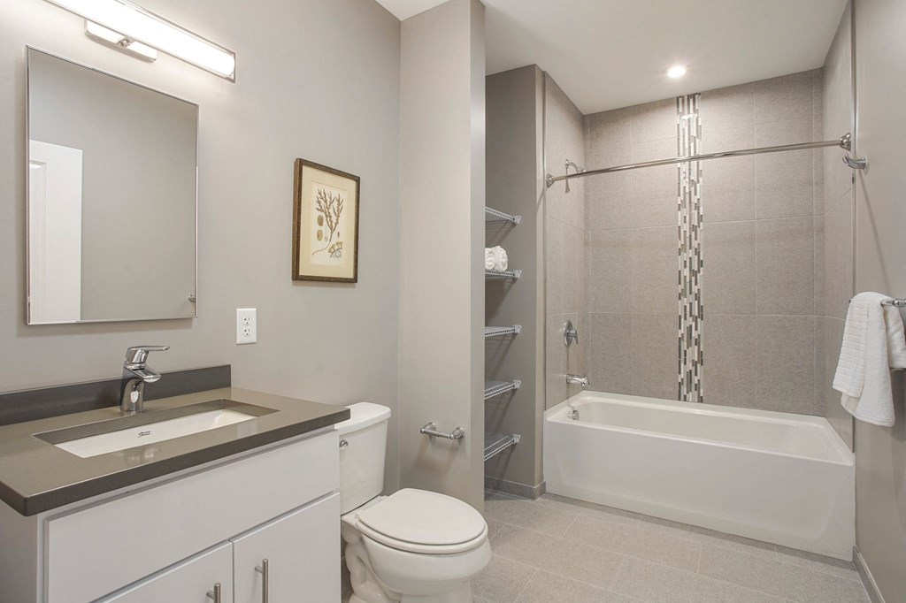 a bathroom with a sink toilet and a shower