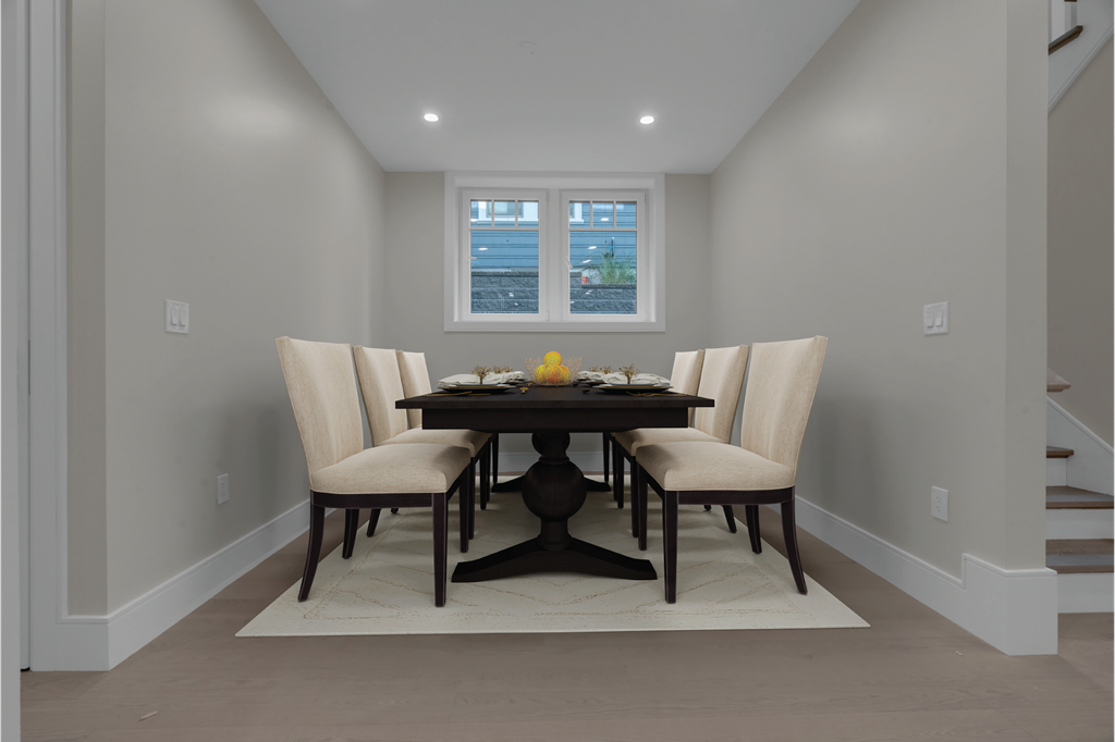 a dining room with a table and chairs