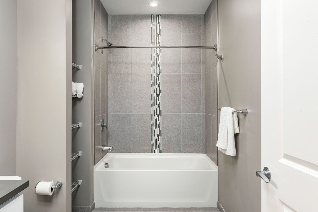 a bathroom with a shower and a bath tub