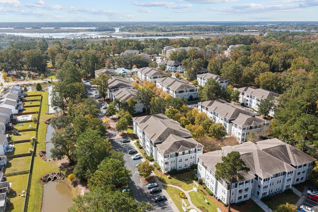 an aerial view of a city with houses and trees