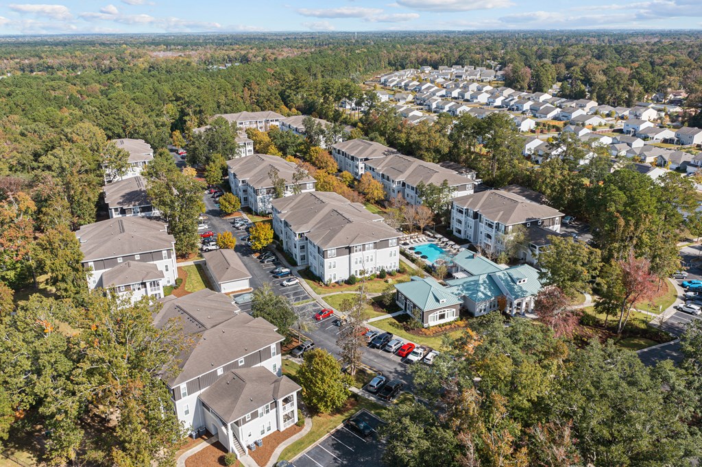 an aerial view of a neighborhood with houses and trees