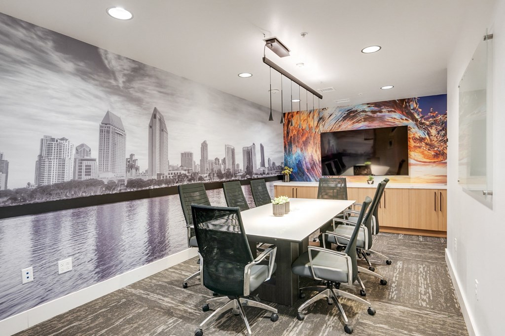 A conference room with a cityscape mural on the wall.