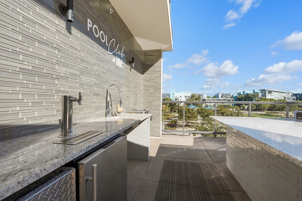 A modern pool club with a view of the pool and the city.
