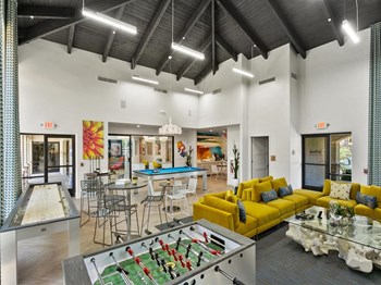 San Portella Apartments Interior Leasing Office with Games - Photo Gallery 5