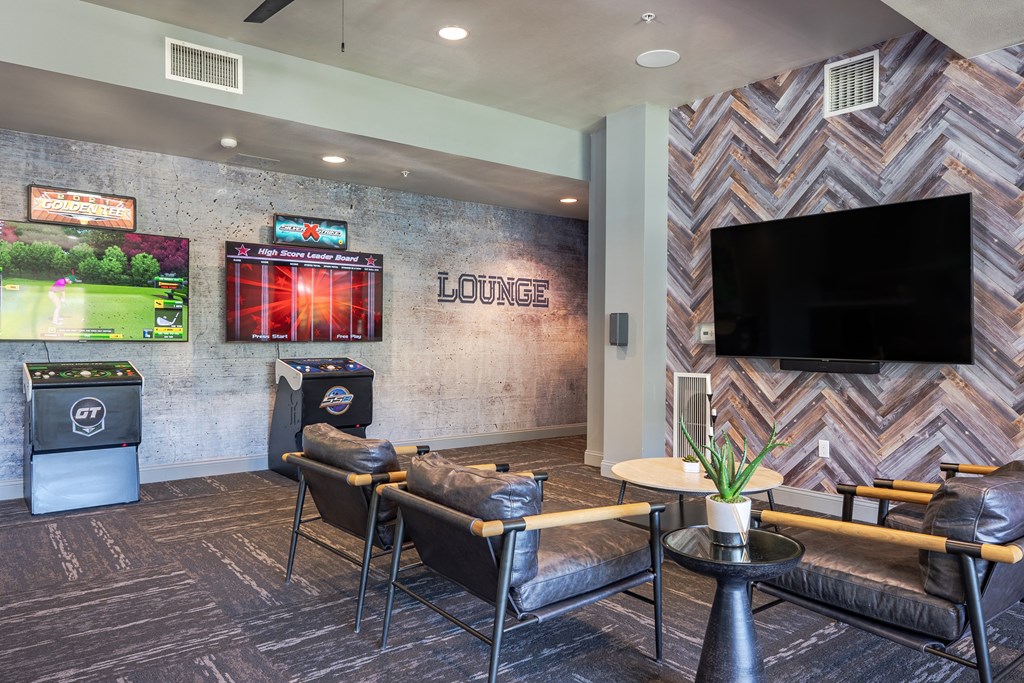 a resident clubhouse with couches and a television