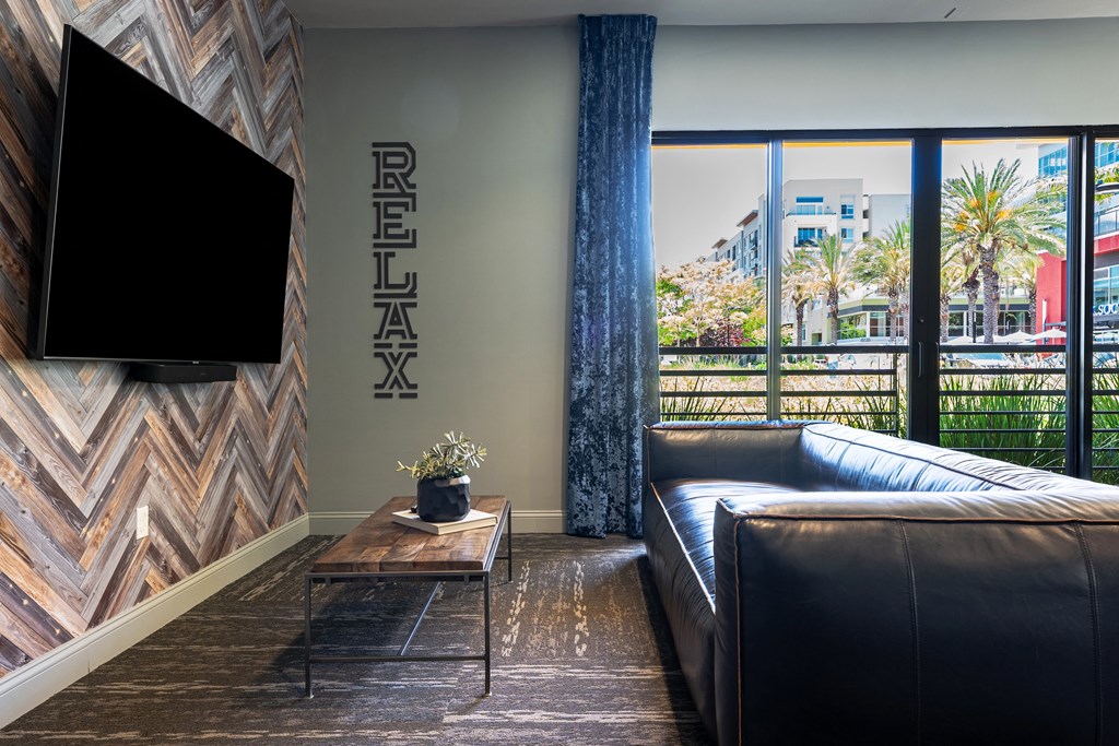 a living room with leather couches and a coffee table