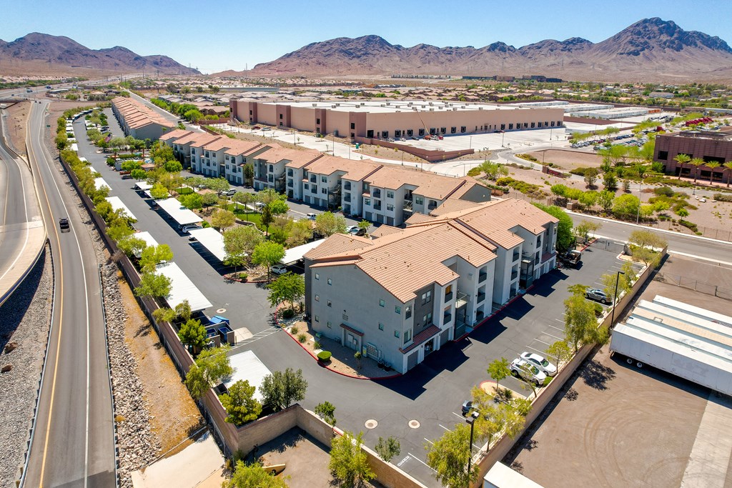 an aerial view of apartment buildings in the middle of a street